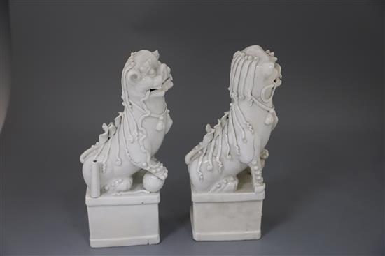 A pair of large Chinese blanc de chine Buddhist Lion joss stick holders, Dehua, Kangxi period, H. 34.5cm